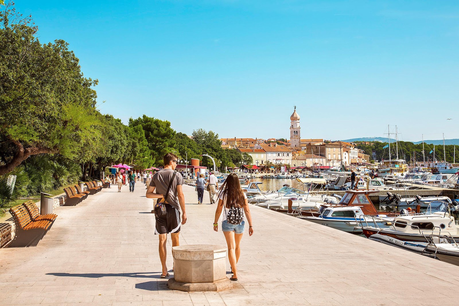 Couple walking near the Krk city centre.