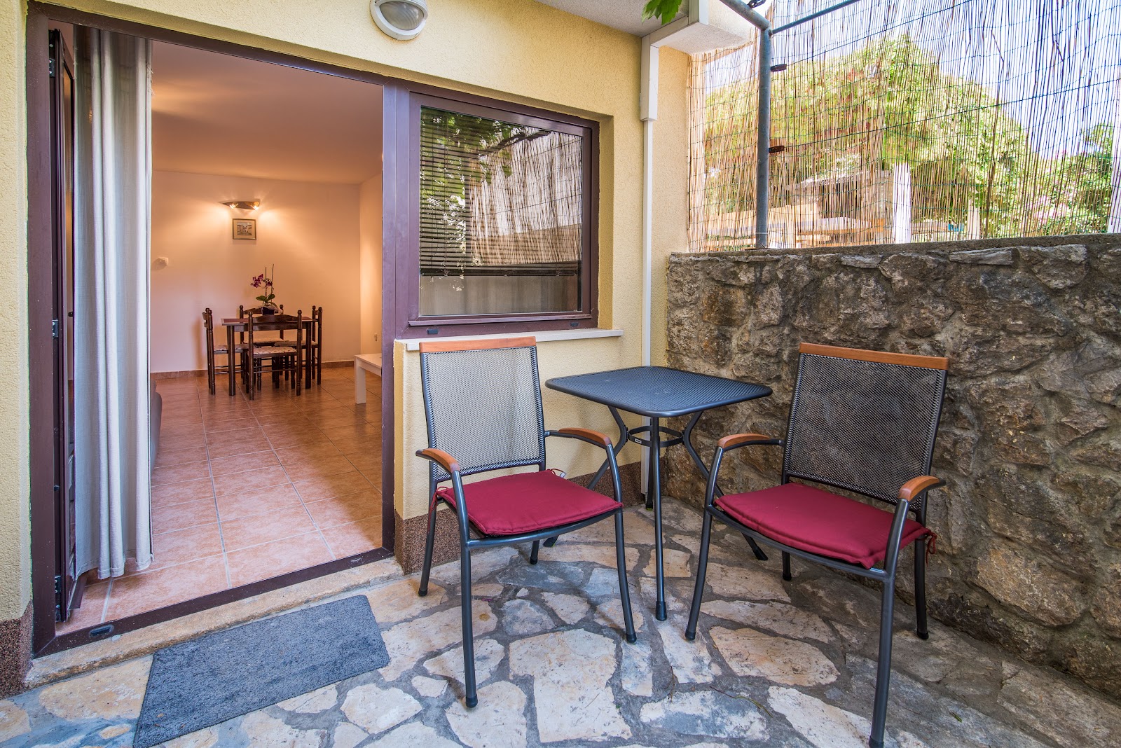 Terrace with garden view in Apartment 6.